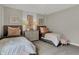 Bright bedroom has 2 twin beds, each adorned with plush pillows and soft lamps at 3449 Glasgow Pl, Danville, IN 46122