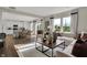 Inviting living room and dining area with hardwood floors, natural light, and open space for comfortable living at 3449 Glasgow Pl, Danville, IN 46122