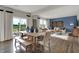 The expansive living space with natural light features an inviting dining area and comfortable seating at 3449 Glasgow Pl, Danville, IN 46122