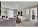 Inviting loft space with comfortable seating, a TV, and easy access to a bedroom, perfect for relaxation at 3449 Glasgow Pl, Danville, IN 46122