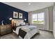 Comfortable main bedroom features a window and an accent wall at 3449 Glasgow Pl, Danville, IN 46122