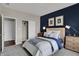 Main bedroom with closet, lamps, window and an accent wall at 3449 Glasgow Pl, Danville, IN 46122