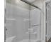 Bright, white shower with glass door and built-in bench at 3449 Glasgow Pl, Danville, IN 46122
