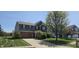 Charming two-story home with a brick-accented facade, attached garage and well-maintained landscaping at 409 Spring Green Pl, Indianapolis, IN 46229