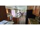 View of the kitchen and living room showing an open concept and wood cabinets at 409 Spring Green Pl, Indianapolis, IN 46229