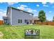 Spacious backyard with a lush lawn, pergola, bench, and privacy fence, perfect for outdoor enjoyment at 442 Mozart Dr, Greenfield, IN 46140