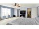 Spacious bedroom with neutral carpet, ceiling fan, and a large window providing natural light and closet access at 442 Mozart Dr, Greenfield, IN 46140