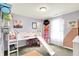 Bright room featuring a lofted bed, whimsical decor, and a play area with toys at 442 Mozart Dr, Greenfield, IN 46140