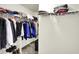 Well-organized closet with clothes hanging on rods and items stored on shelves at 442 Mozart Dr, Greenfield, IN 46140