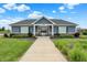 Charming community center exterior with manicured landscaping and welcoming walkway at 442 Mozart Dr, Greenfield, IN 46140
