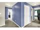 Hallway with neutral paint and doorways leading to other rooms within the home at 442 Mozart Dr, Greenfield, IN 46140