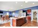 Open concept kitchen and dining area with stainless steel appliances and a pantry at 442 Mozart Dr, Greenfield, IN 46140