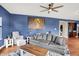 Cozy living room showcases a plush sofa, a matching chair, and a large framed wall art at 442 Mozart Dr, Greenfield, IN 46140