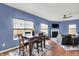 Open-plan living room with dining area, fireplace, and comfortable seating arrangement at 442 Mozart Dr, Greenfield, IN 46140