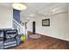 Spacious living room showcasing beautiful hardwood floors, a staircase, and ample seating at 442 Mozart Dr, Greenfield, IN 46140