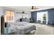 Comfortable main bedroom with large windows, neutral tones, and a ceiling fan at 442 Mozart Dr, Greenfield, IN 46140