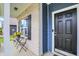Welcoming porch with decorative flower display and cozy seating area at 442 Mozart Dr, Greenfield, IN 46140