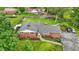 Aerial view of the brick house with manicured lawn and mature trees at 4614 Thornleigh Dr, Indianapolis, IN 46226