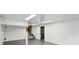 Large basement with painted walls and floors, ready for customization with ample lighting at 4614 Thornleigh Dr, Indianapolis, IN 46226