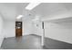 Large basement with painted walls and floors, ready for customization with ample lighting at 4614 Thornleigh Dr, Indianapolis, IN 46226