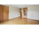 Bedroom featuring hardwood floors, closet, entry doors and neutral walls at 4614 Thornleigh Dr, Indianapolis, IN 46226