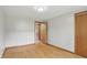 Bedroom featuring hardwood floors, closets, entry doors and neutral walls at 4614 Thornleigh Dr, Indianapolis, IN 46226