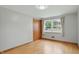 Bedroom features hardwood floors, a closet, window with views and beige drapes at 4614 Thornleigh Dr, Indianapolis, IN 46226