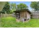 Backyard chicken coop adjacent to fenced area at 4614 Thornleigh Dr, Indianapolis, IN 46226