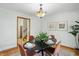 The dining room has a modern table, decor and easy access to other parts of the home at 4614 Thornleigh Dr, Indianapolis, IN 46226