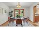 This dining room has easy access to a patio and stainless appliances in the kitchen at 4614 Thornleigh Dr, Indianapolis, IN 46226