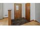 Inviting foyer features a unique tiled floor and a charming wooden front door with decorative glass at 4614 Thornleigh Dr, Indianapolis, IN 46226