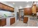 Practical kitchen layout with wood cabinets and built-in oven at 4614 Thornleigh Dr, Indianapolis, IN 46226