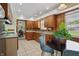 Updated kitchen with wood cabinets and granite countertops at 4614 Thornleigh Dr, Indianapolis, IN 46226