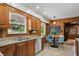 Bright kitchen featuring stainless steel appliances, granite countertops, and a window view at 4614 Thornleigh Dr, Indianapolis, IN 46226