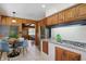This kitchen offers modern appliances, a granite countertop, and charming wood-paneled walls at 4614 Thornleigh Dr, Indianapolis, IN 46226