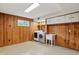 Bright laundry room offers a convenient utility sink and wooden cabinets for storage space at 4614 Thornleigh Dr, Indianapolis, IN 46226
