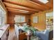 Charming living room with wood paneling, skylights, and hardwood floors at 4614 Thornleigh Dr, Indianapolis, IN 46226