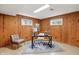 Well-lit office space features wood walls, modern furniture, and ample light, creating an inspiring work environment at 4614 Thornleigh Dr, Indianapolis, IN 46226
