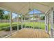 Screened porch overlooking a lush backyard offering a serene and bug-free outdoor experience at 4614 Thornleigh Dr, Indianapolis, IN 46226