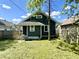 A view of a quaint backyard with a freshly cut lawn and privacy fence around the property at 4814 E New York St, Indianapolis, IN 46201