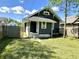 View of a quaint backyard with a freshly cut lawn and privacy fence around the property at 4814 E New York St, Indianapolis, IN 46201