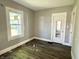 Cozy bedroom with natural light and wood-look flooring at 4814 E New York St, Indianapolis, IN 46201