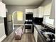 The kitchen features stainless steel appliances, and modern cabinets at 4814 E New York St, Indianapolis, IN 46201