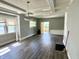 Spacious living room with wood floors and natural light, ready for your personal touch at 4814 E New York St, Indianapolis, IN 46201
