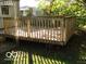 Spacious backyard deck for outdoor enjoyment and relaxation, surrounded by greenery at 4830 Wentworth Blvd, Indianapolis, IN 46201