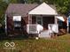 Charming one-story brick home with a covered front porch and tidy landscaping at 4830 Wentworth Blvd, Indianapolis, IN 46201