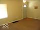 Bright living room featuring large window and neutral paint palette at 4830 Wentworth Blvd, Indianapolis, IN 46201