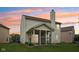 Backyard featuring a screened-in porch and lush green lawn, perfect for outdoor relaxation and entertainment at 513 Sun Catcher Dr, Avon, IN 46123