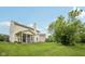 Image displays the beautiful yard and the screened-in porch at 513 Sun Catcher Dr, Avon, IN 46123