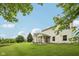 Lush backyard with a screened porch on a well-maintained lawn at 513 Sun Catcher Dr, Avon, IN 46123